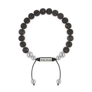 Top view of an 8mm Black Pave beaded shamballa bracelet with silver stainless steel logo bead made by Voltlin