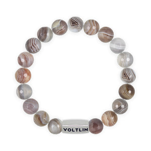 Top view of a 10mm Faceted Botswana Agate beaded stretch bracelet with silver stainless steel logo bead made by Voltlin
