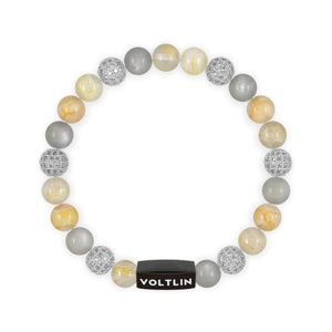 Top view of an 8 mm Golden Sirius beaded stretch bracelet featuring Rutilated Quartz, Silver Pave, Moonstone, & Citrine crystal and black stainless steel logo bead made by Voltlin
