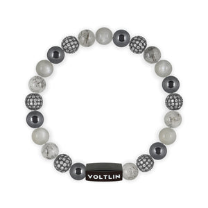 Top view of an 8 mm Gray Sirius beaded stretch bracelet featuring Hematite, Steel Pave, Tourmalinated Quartz, & Moonstone crystal and black stainless steel logo bead made by Voltlin