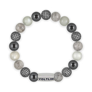 Top view of a 10mm Gray Sirius beaded stretch bracelet featuring Hematite, Steel Pave, Tourmalinated Quartz, & Moonstone crystal and silver stainless steel logo bead made by Voltlin