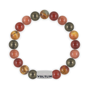 Top view of a 10mm Sacral Chakra beaded stretch bracelet featuring Pyrite, Red Creek Jasper, Carnelian, & Red Goldstone crystal and silver stainless steel logo bead made by Voltlin