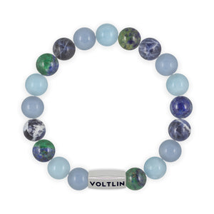 Top view of a 10mm Throat Chakra beaded stretch bracelet featuring Angelite, Aquamarine, Azurite, & Sodalite crystal and silver stainless steel logo bead made by Voltlin