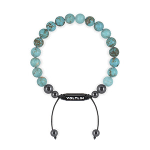 Top view of an 8mm Turquoise crystal beaded shamballa bracelet with black stainless steel logo bead made by Voltlin