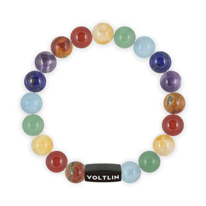 Top view of a 10mm 7 Chakra beaded stretch bracelet featuring Red Creek Jasper, Carnelian, Citrine, Green Aventurine, Aquamarine, Lapis Lazuli, & Amethyst crystal and black stainless steel logo bead made by Voltlin