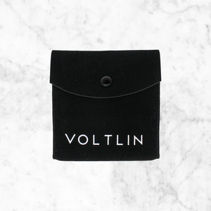 Black suede jewelry pouch with Voltlin's logo