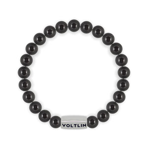 Top view of an 8mm Black Tourmaline beaded stretch bracelet with silver stainless steel logo bead made by Voltlin