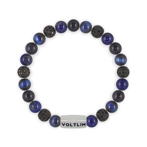 Top view of an 8mm Blue Sirius beaded stretch bracelet featuring Blue Tiger’s Eye, Black Pave, Lapis Lazuli, & Blue Goldstone crystal and silver stainless steel logo bead made by Voltlin