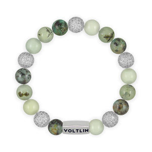 Top view of a 10mm Celadon Sirius beaded stretch bracelet featuring African Turquoise, Silver Pave, Jade, & Prehnite crystal and silver stainless steel logo bead made by Voltlin