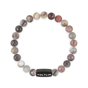Top view of an 8mm Faceted Botswana Agate crystal beaded stretch bracelet with black stainless steel logo bead made by Voltlin