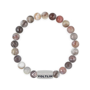 Top view of an 8mm Faceted Botswana Agate beaded stretch bracelet with silver stainless steel logo bead made by Voltlin