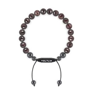 Top view of an 8mm Faceted Garnet crystal beaded shamballa bracelet with black stainless steel logo bead made by Voltlin