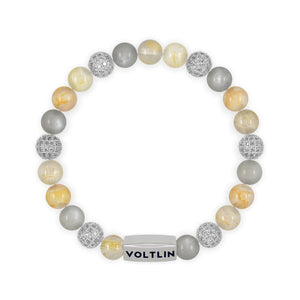 Top view of an 8mm Golden Sirius beaded stretch bracelet featuring Rutilated Quartz, Silver Pave, Moonstone, & Citrine crystal and silver stainless steel logo bead made by Voltlin