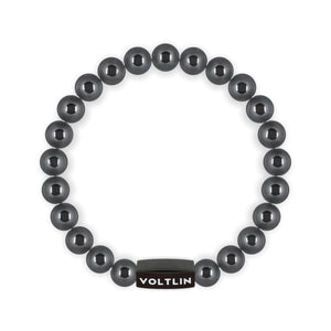 Top view of an 8mm Hematite crystal beaded stretch bracelet with black stainless steel logo bead made by Voltlin