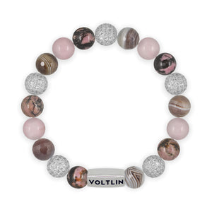 Top view of a 10mm Mauve Sirius beaded stretch bracelet featuring Rhodonite, Silver Pave, Faceted Botswana Agate, & Rose Quartz crystal and silver stainless steel logo bead made by Voltlin