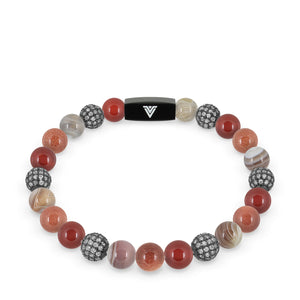 Front view of an 8mm Sienna Sirius beaded stretch bracelet featuring Carnelian, Steel Pave, Smooth Botswana Agate, & Red Goldstone crystal and black stainless steel logo bead made by Voltlin