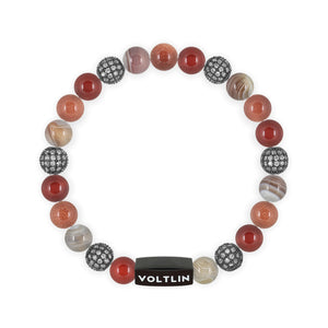Top view of an 8 mm Sienna Sirius beaded stretch bracelet featuring Carnelian, Steel Pave, Smooth Botswana Agate, & Red Goldstone crystal and black stainless steel logo bead made by Voltlin