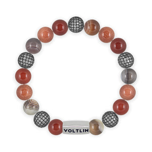 Top view of a 10mm Sienna Sirius beaded stretch bracelet featuring Carnelian, Steel Pave, Smooth Botswana Agate, & Red Goldstone crystal and silver stainless steel logo bead made by Voltlin