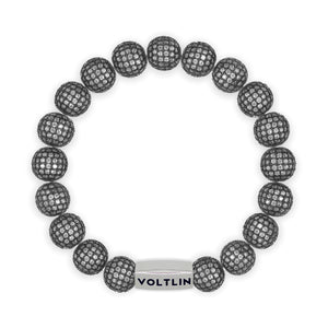 Top view of a 10mm Steel Pave beaded stretch bracelet with silver stainless steel logo bead made by Voltlin