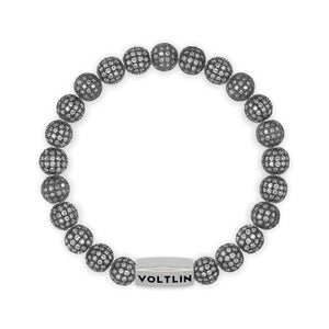 Top view of an 8mm Steel Pave beaded stretch bracelet with silver stainless steel logo bead made by Voltlin