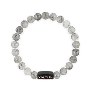 Top view of an 8mm Tourmalinated Quartz crystal beaded stretch bracelet with black stainless steel logo bead made by Voltlin