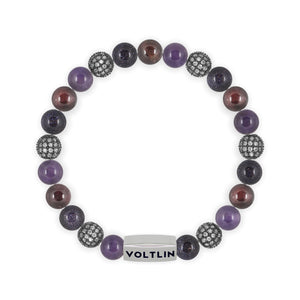 Top view of an 8mm Violet Sirius beaded stretch bracelet featuring Amethyst, Steel Pave, Blue Goldstone, & Smooth Garnet crystal and silver stainless steel logo bead made by Voltlin