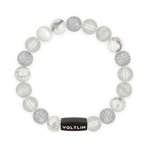 Top view of a 10 mm White Sirius beaded stretch bracelet featuring Howlite, Silver Pave, Quartz, & Selenite crystal and black stainless steel logo bead made by Voltlin