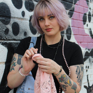 A female model wearing our Rose Quartz Stretch Bracelet from Voltlin